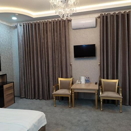 Diyor Hotel Marghilon Bagian luar foto