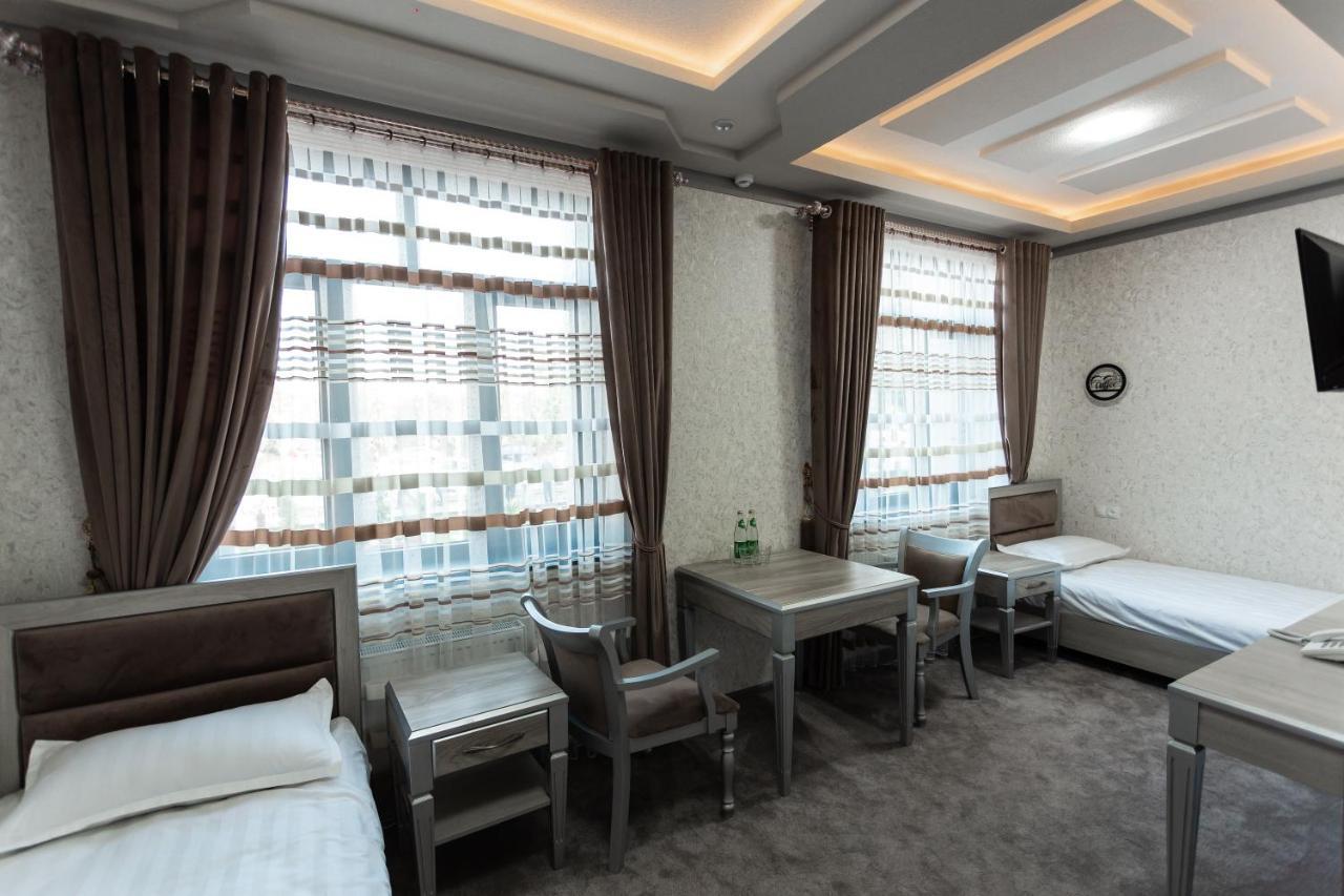 Diyor Hotel Marghilon Bagian luar foto