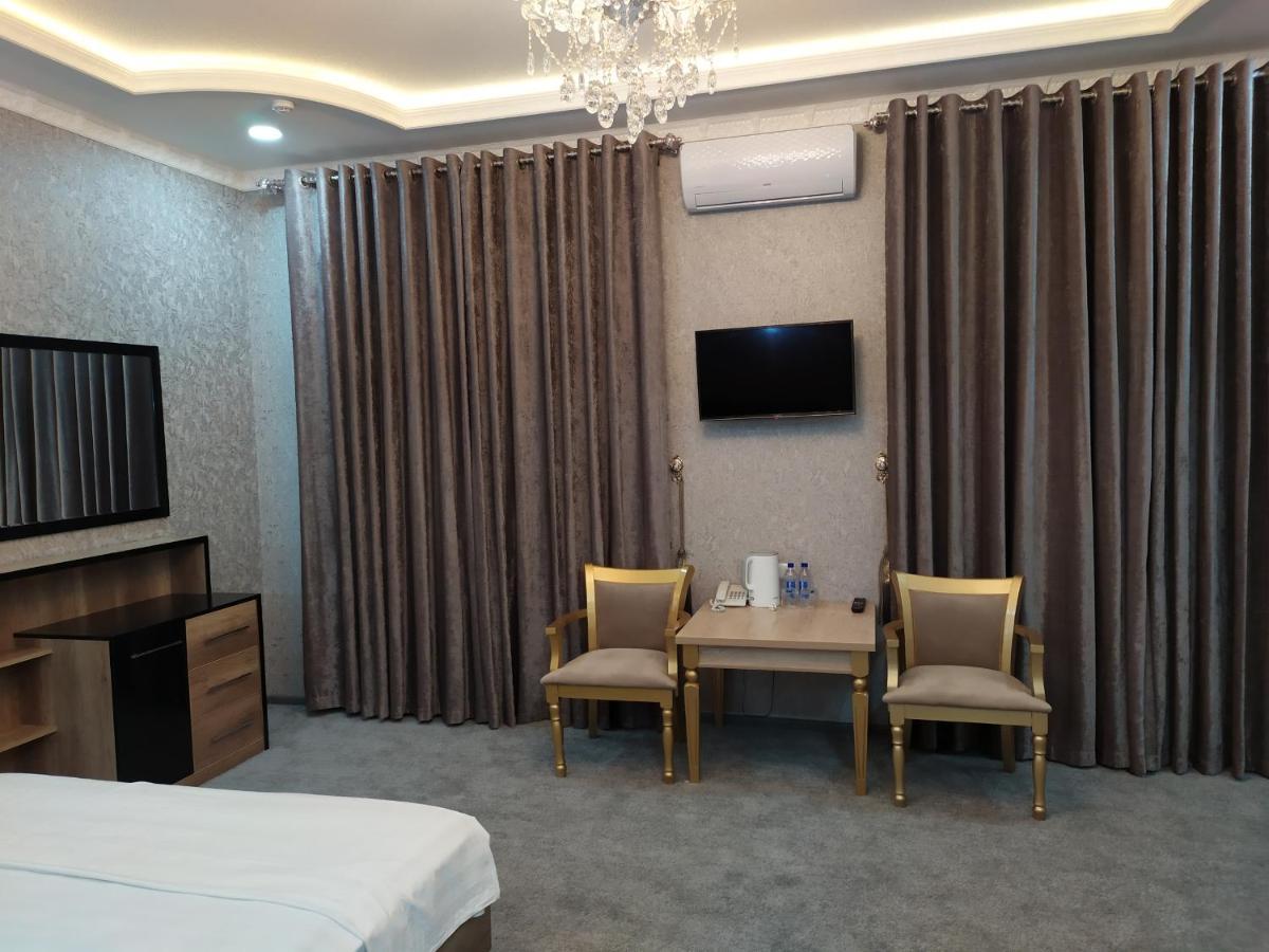 Diyor Hotel Marghilon Bagian luar foto