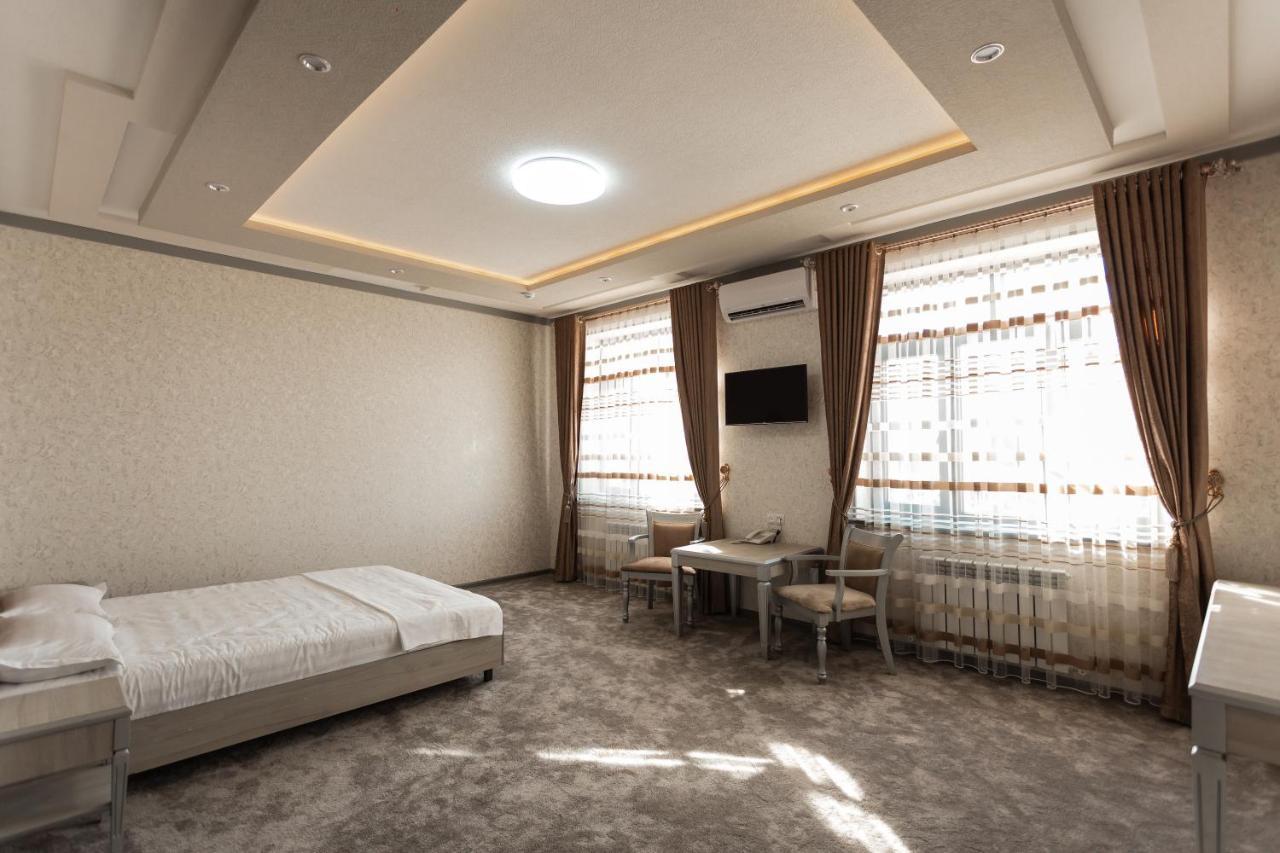 Diyor Hotel Marghilon Bagian luar foto