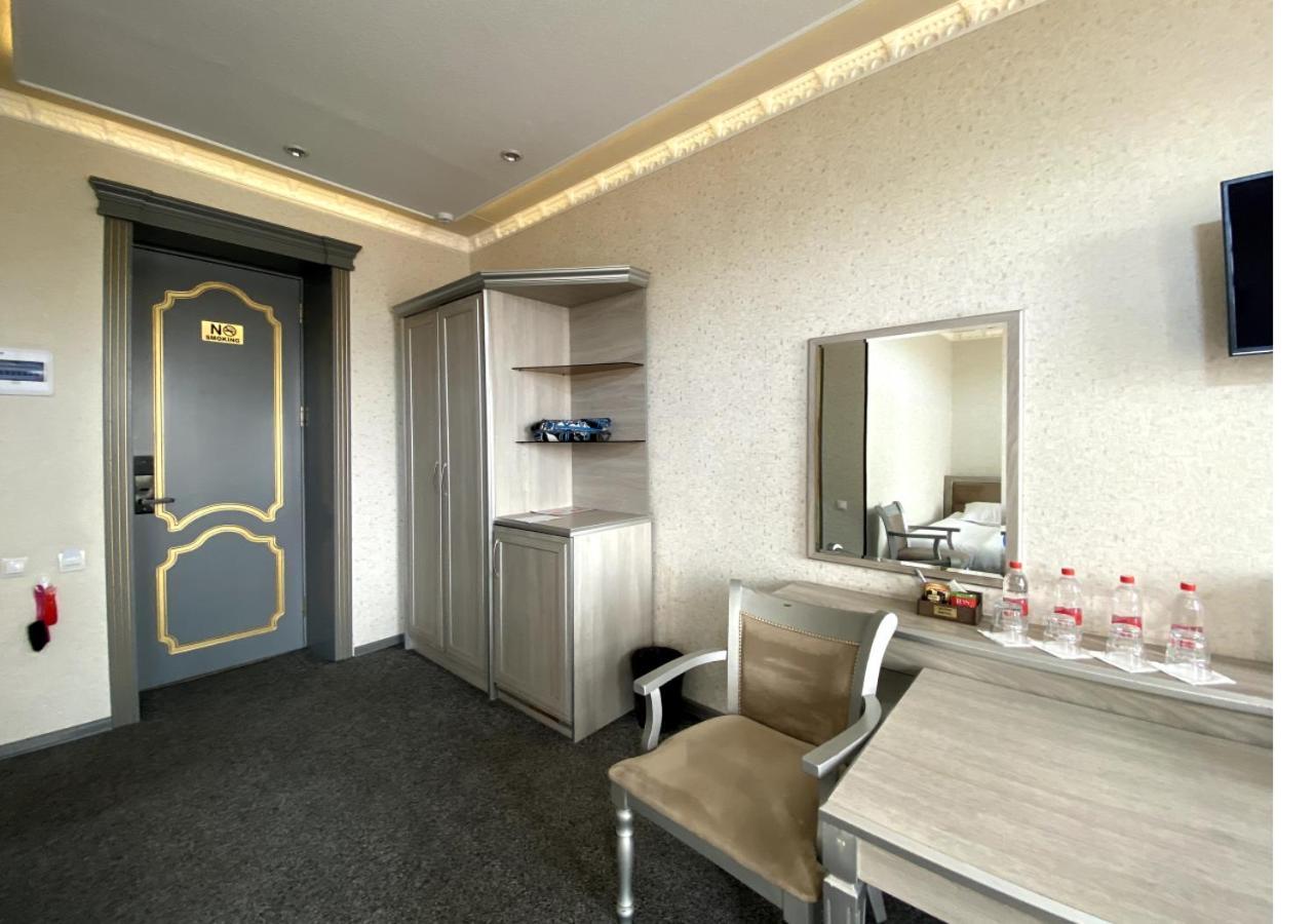 Diyor Hotel Marghilon Bagian luar foto