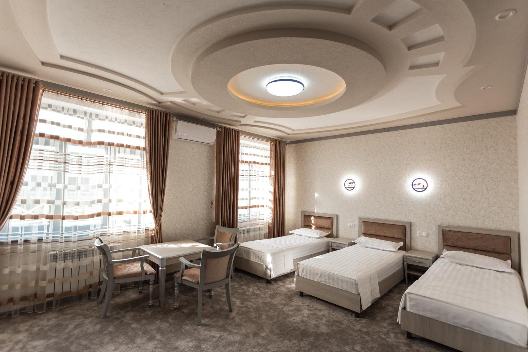 Diyor Hotel Marghilon Bagian luar foto